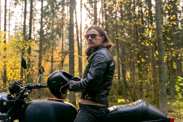 man wearing polarised sunglasses on a motorbike